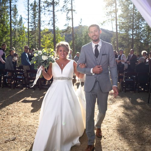 Triumphantly walking back down the aisle after wedding